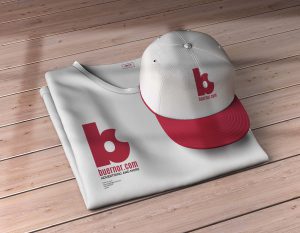 Sport Cap and Folded T-Shirt Mockup on Wood Texture